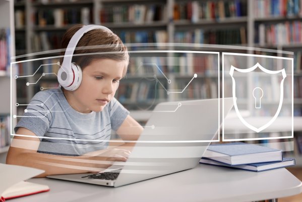 Child with headphones on safe computer with lock icon 